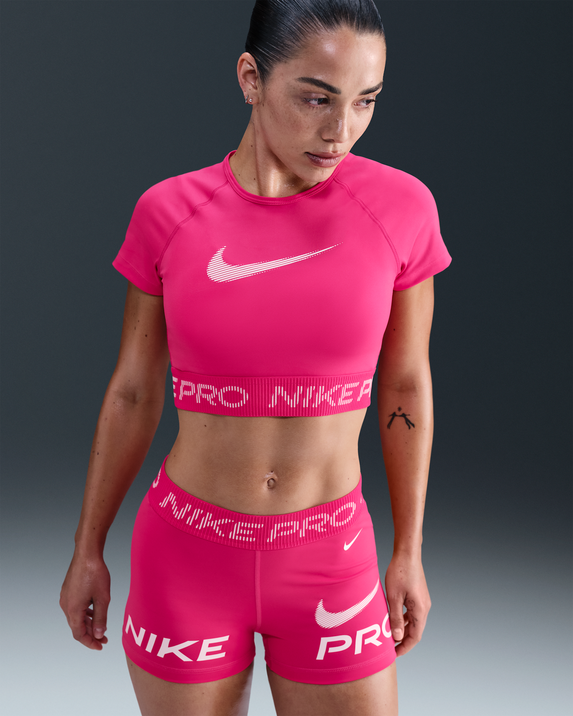 Nike Pro Women's Dri-FIT Short-Sleeve Cropped Graphic Top. Nike LU